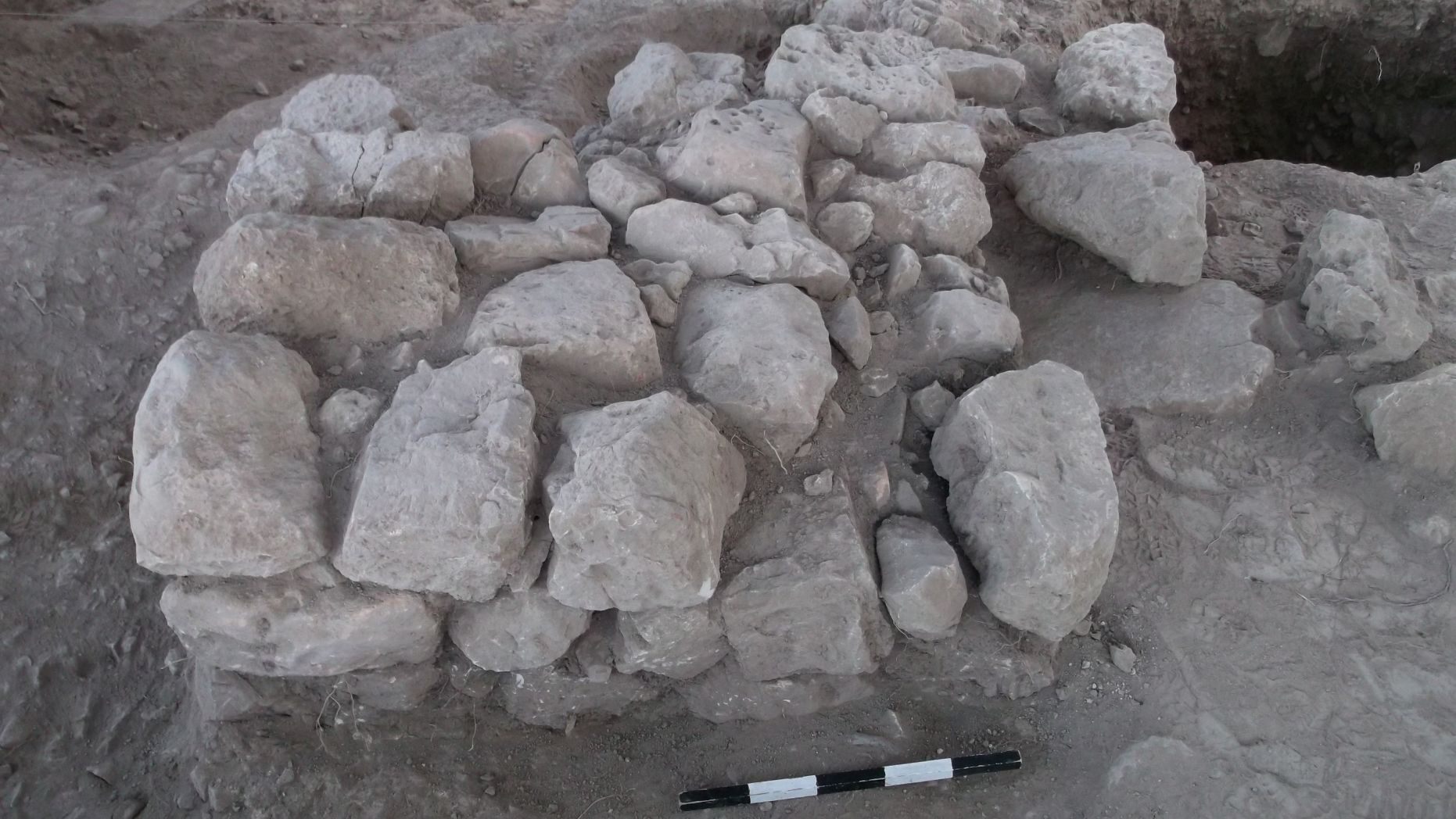 Ancient stone altar and refuse pit at the site. (Tel Aviv University)